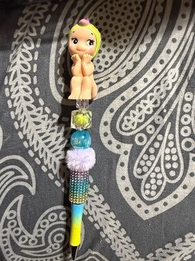 Colorful rhinestone beaded pen with Sonny Angel topper.